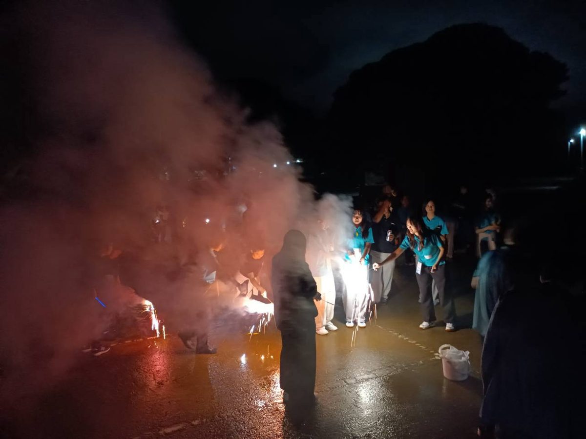Lighting the hand-held fireworks